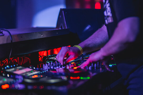 close view of a Jacksonville Drum & Bass deejay performing on disc jockey equipment