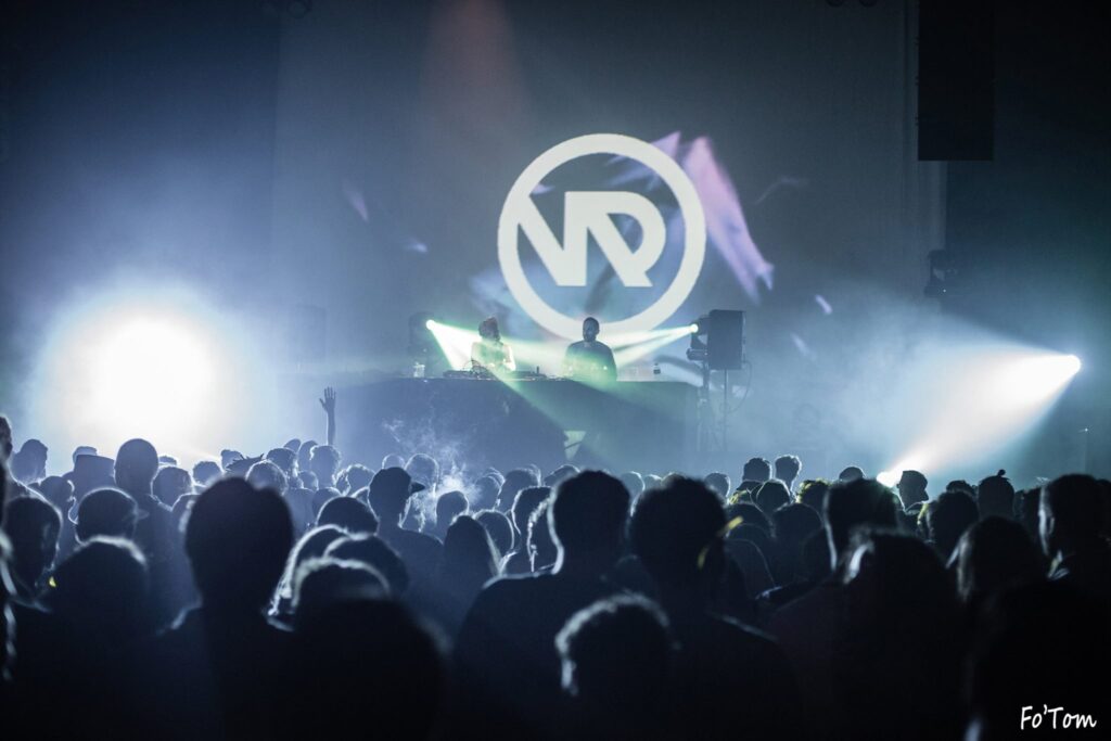 Quadrant + Iris performing live in front of a very large crowd
